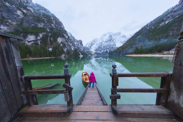 Braies Lake in Dolomites mountains Seekofel in background, Sudtirol, Italy. Lake Braies is also known as Lago di Braies. The lake is surrounded by the mountains which are reflected in the water.