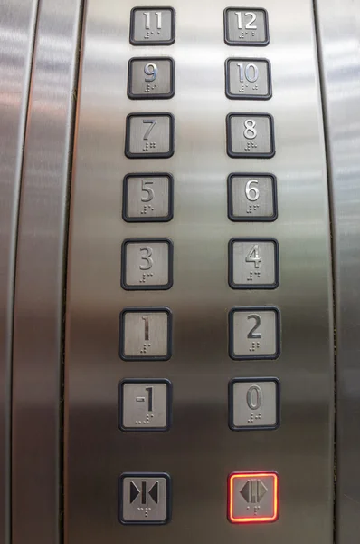 Botones en ascensor, uno a doce Fotos de stock libres de derechos