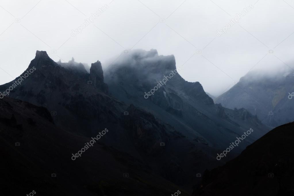Fog over Rugged Mountains
