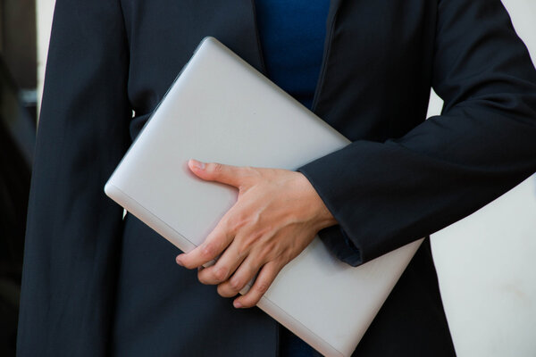 Business women holding laptop