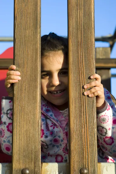 Niña en el patio de recreo —  Fotos de Stock