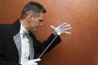 Magician performing with wand clipart