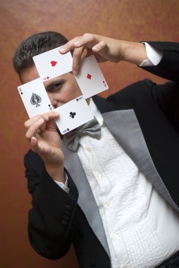 Magician performing with cards clipart