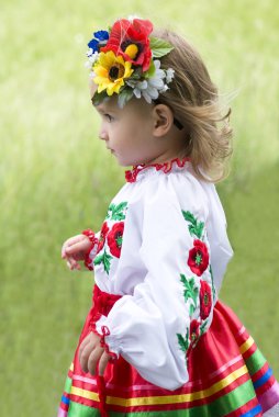 Little girl in traditional Ukrainian costume clipart