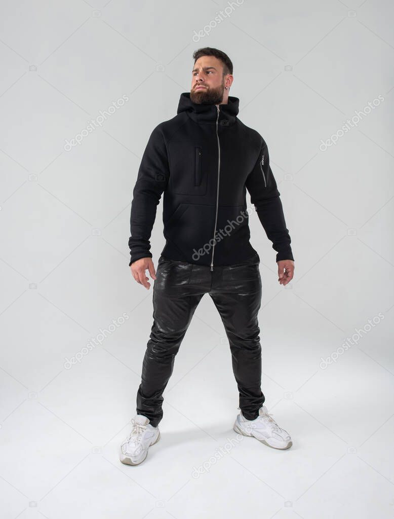 Bearded handsome man in black casual outfit