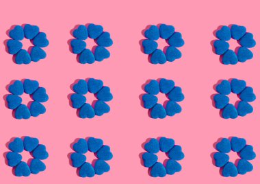 blue hearts marmalade on a pink background pattern. High quality photo