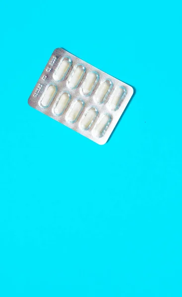 Φουσκάλες Λευκά Χάπια Μπλε Φόντο Υψηλής Ποιότητας Φωτογραφία — Φωτογραφία Αρχείου