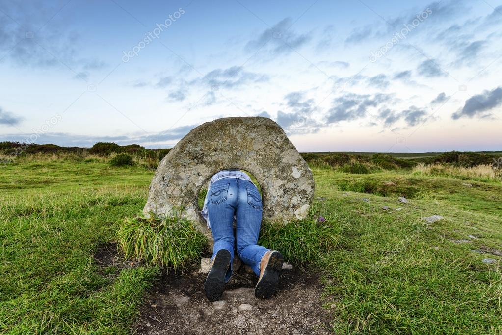 The Men-an-Tol standing stones Near Penzance in Cornwall, local legend says that if a woman passes backwards through the holded stone seven times on a full moon she will soon become pregnant.