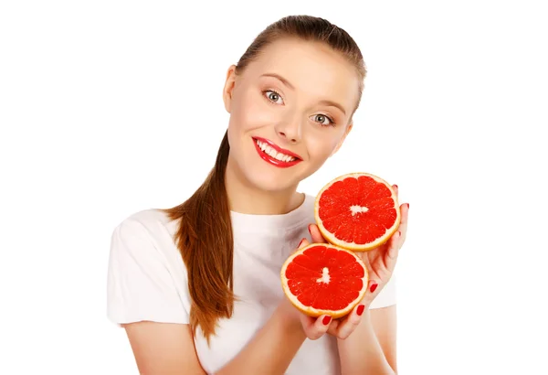Young blonde woman with grapefruit in her hands studio portrait — Stock Photo, Image