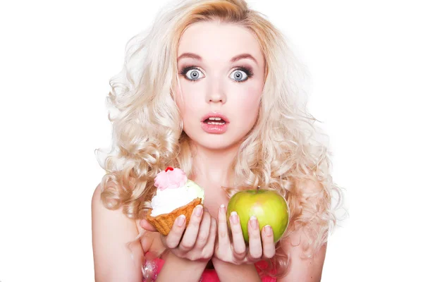 Girl with cupcake and apple — Stock Photo, Image