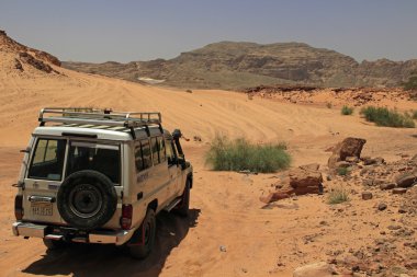 Jeep safari in Sinai desert clipart