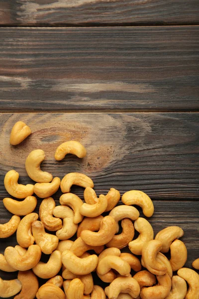 Cashew Nuts Brown Wooden Background Vertical Photo — Stock Photo, Image