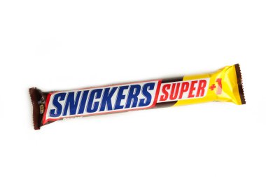 Nikolaev, Ukraine - December 19, 2021 Snickers chocolate bar isolated on white background. Snickers is a brand name chocolate bar made by the American company Mars. Top view.