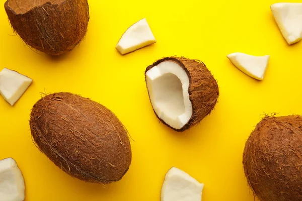 Coconut Yellow Background Halves Whole Coconuts — Stockfoto