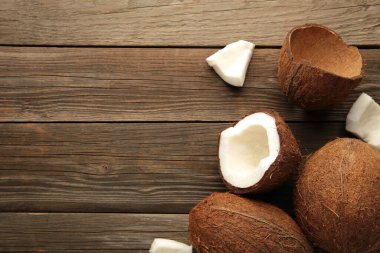 Fresh coconut on grey wooden background. Top view.