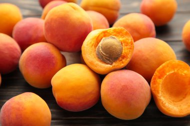 Fresh apricots on brown background. Macro foto. top view