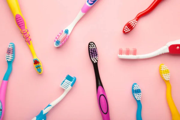 Colorful Toothbrushes Pink Background Copy Space Top View — Stockfoto