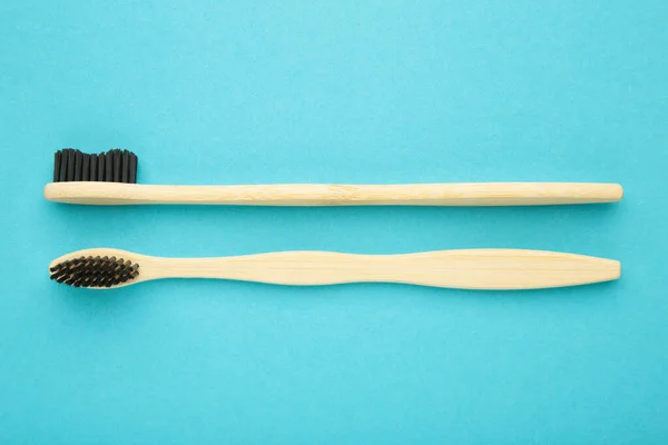 Bamboo Wood Toothbrush Black Brush Bristles Blue Background Top View — Stockfoto