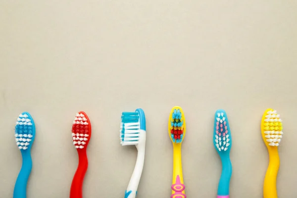 Colorful Toothbrushes Grey Background Top View — Stock Photo, Image