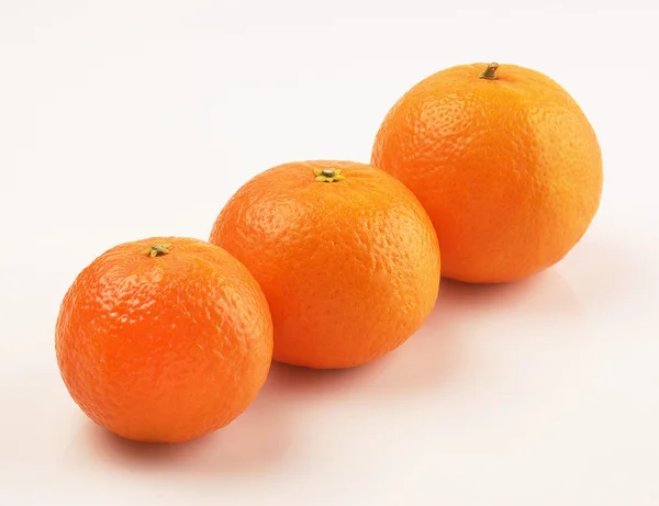 Three whole tangerine on a white background — Stock Photo, Image