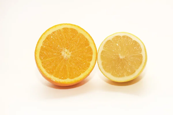 Orange and lemon halves on white background — Stock Photo, Image