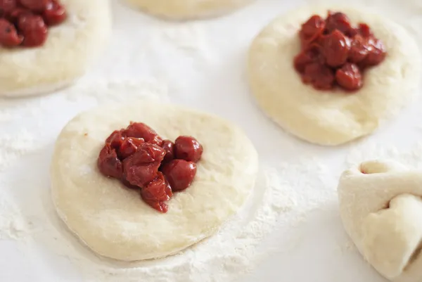 Making cherry bun — Stock Photo, Image