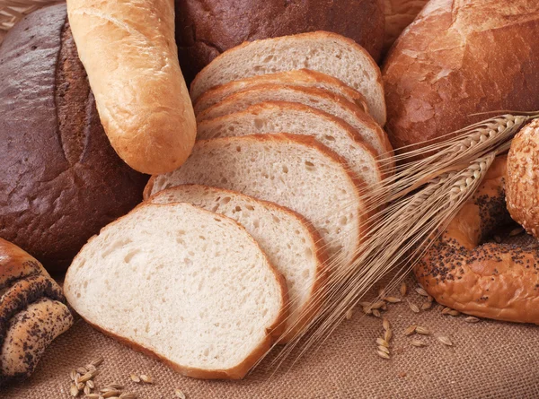 Composition of bread and wheat spikelets — Stock Photo, Image