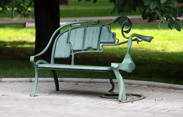 Metal forged bench in summer park — Stock Photo, Image