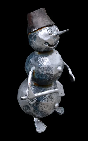 Isolated forged metal snowman with a hammer on a black backgroun — Stock Photo, Image