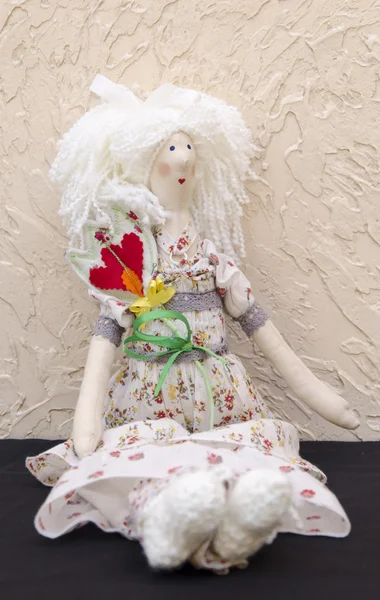 Handmade doll with a flower in his belt in a long white dress si — Stock Photo, Image