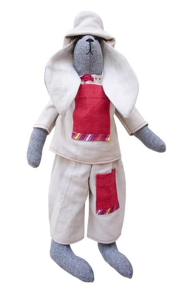 Isolierte handgemachte Puppe Hase in selbstgestrickter Jacke, Hose mit Tasche — Stockfoto