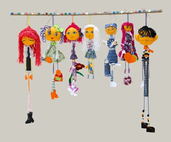 Six female and one male handmade isolated thin dolls toys in fas — Stock Photo, Image