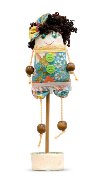 Handmade doll soft toy isolated funny girl on the stand