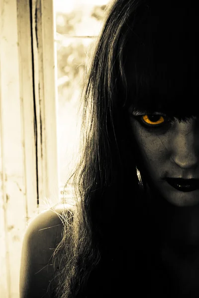 creepy girl with black hair and doll