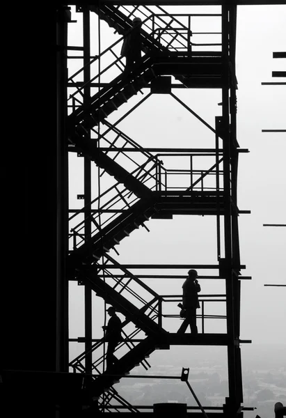Silhouettes of at the industrial project — Stock Photo, Image
