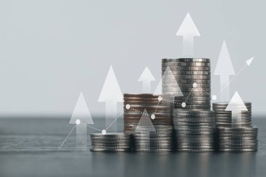 Coin stack with growth chart and graph progress , Market finance and Investments growing with businessman investor , finance and business concept