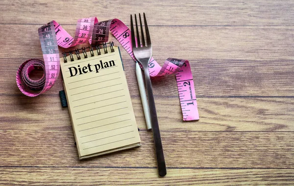 Diet Plan Concept Notebook Fork Pink Measuring Tape Wooden Background — Stock Photo, Image