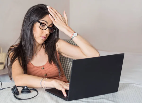 Beautiful Shocked Woman Looking her Laptop. Angry Woman Working from Home
