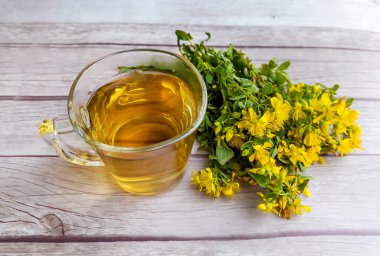 Glass Cup of Healthy Herbal Tea with St. John's Wort herb