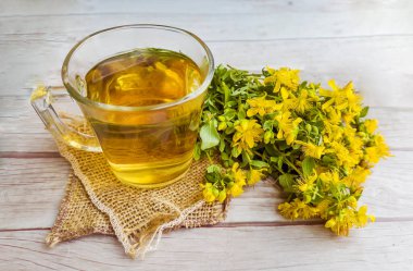 Glass Cup of Healthy Herbal Tea with St. John's Wort herb