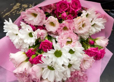 Beautiful big pink bouquet with pink roses and white chrysanthemums