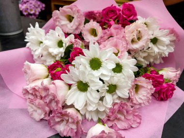 Beautiful big pink bouquet with pink roses and white chrysanthemums