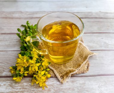 Glass Cup of Healthy Herbal Tea with St. John's Wort herb