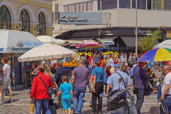 Athens, Greece - May 3, 2015: Many people at entrance to Athens city Monastiraki flea market place at busy day.