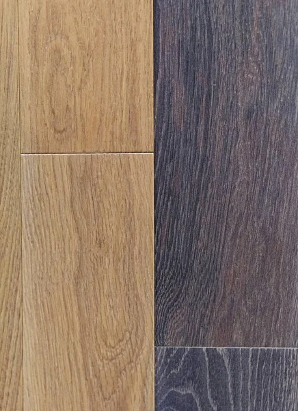 Two color light and dark laminate parquet flooring tiles dividing line