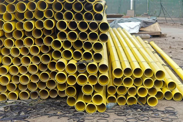 New Yellow Pipes Material Stack Construction Site — Foto de Stock