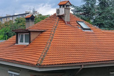 New ceramic orange roof tiles at house