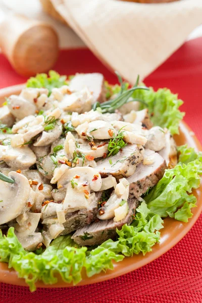 Pork cut into slices and mushrooms with the cream — Stock Photo, Image