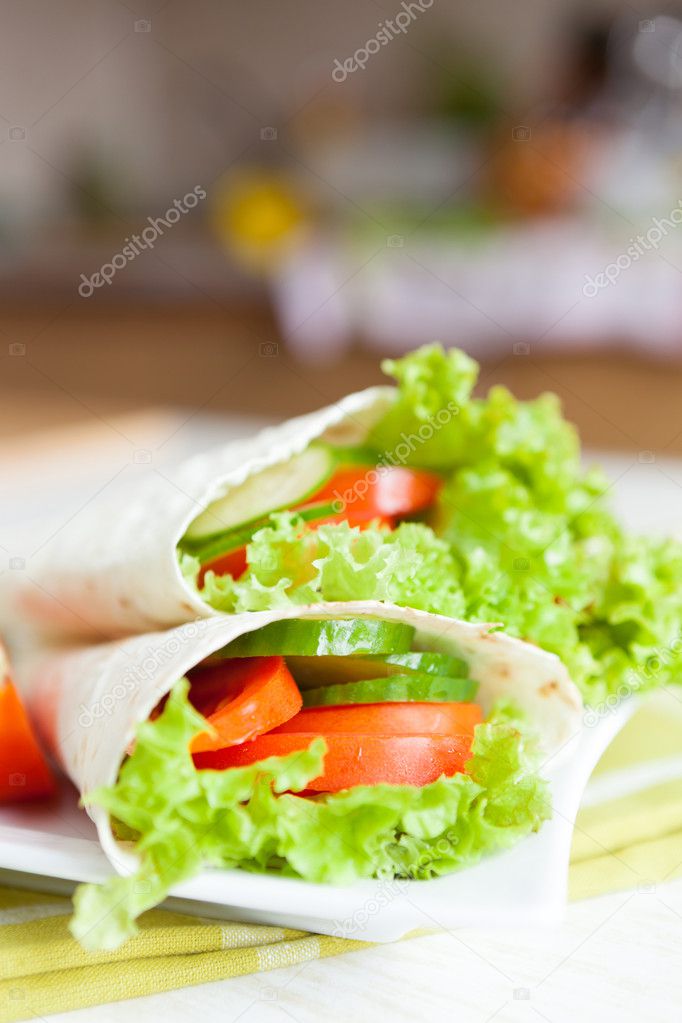 thin pita bread and a salad of fresh vegetables