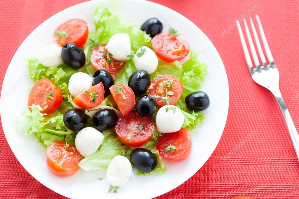Greek salad with mozzarella, top view Stock Photo by ©olhaafanasieva